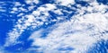 White cirrus clouds blue sky background, beautiful wispy cloudscape wide panoramic view, cumulus cloudy skies panorama, cloudiness