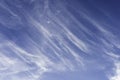 White cirrus clouds expanding by wind moving like waves to cover navy blue sky background in tropical summer, Nature weather, copy