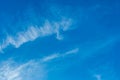 White cirrus clouds weather change wind natural background against the blue sky Royalty Free Stock Photo
