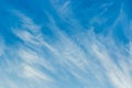 White cirrus clouds weather change wind natural background against the blue sky Royalty Free Stock Photo