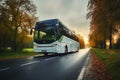 A white city bus journeys through Polands scenic countryside on a cloudy day