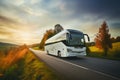 A white city bus traverses the scenic Polish countryside on a cloudy day