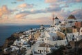 White city on a slope of a hill at sunset, Oia, Santorini, Greece Royalty Free Stock Photo