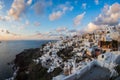 White city on a slope of a hill at sunset, Oia, Santorini, Greece Royalty Free Stock Photo