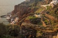 White city on a slope of a hill at sunset, Oia, Santorini, Greece Royalty Free Stock Photo