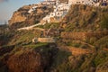 White city on a slope of a hill at sunset, Oia, Santorini, Greece Royalty Free Stock Photo