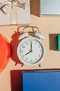 White classic alarm clock with gift items Royalty Free Stock Photo