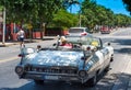 White classic cabriolet car in the back view in Varadero Cuba with driver