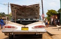 A white classic car parked on the road Royalty Free Stock Photo