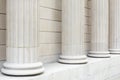 White classical columns and wall background