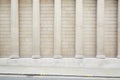 White classical columns and wall background