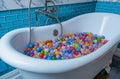 Bathtub filled with colorful balls