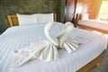 White clean bath towel on bed decoration interior of bedroom - White towel on bed in guest room for hotel customer Royalty Free Stock Photo
