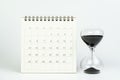 White clean calendar with sandglass or hourglass on white background using as timer or time counting down or business plan with