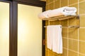 White clean comfortable towel hanging on wall decoration in bathroom and toilet Royalty Free Stock Photo