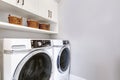 White clean laundry room modern with washer and dryer Royalty Free Stock Photo