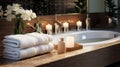 White, clean, neatly folded towels lie on a wooden table . The theme of staying at the hotel is relaxation and comfort