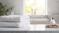 White clean towels on wooden table in bathroom. Spa Royalty Free Stock Photo