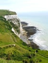 White cliffs of Dover. Tourist destination. Waves crashing against limestone cliff Royalty Free Stock Photo