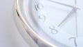 White clock face ticking. Close-up soft focus. Royalty Free Stock Photo