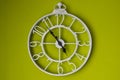 White clock on a green wall Royalty Free Stock Photo