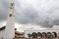 White clock tower with colonial arc structure at Guatavita colombian town