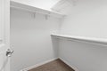 White closet with a door and shelves Royalty Free Stock Photo