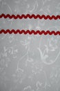 White cloth background with two red ribbons Royalty Free Stock Photo