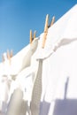 White clothes hung out to dry in the bright warm sun