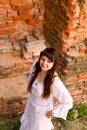 White clothes on a young girl on brick wall background Royalty Free Stock Photo