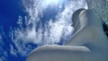 White cloud and big white Buddha sculpture under blue sky Royalty Free Stock Photo
