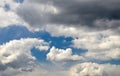 White cloud among dark rain clouds Royalty Free Stock Photo