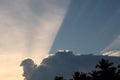 A white cloud formed like a human head. and a line of light shines through the sky Royalty Free Stock Photo