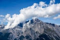 White cloud beside mountain with blue sky Royalty Free Stock Photo