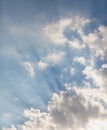 White cloud and rays of sun over roof of house Royalty Free Stock Photo