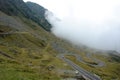 White cloud and scenic winding Transfagarasan mountain road in Romania Royalty Free Stock Photo