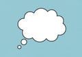 White cloud-shaped thought bubble with a black outline against a Royalty Free Stock Photo