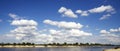 White clouds above the river . Royalty Free Stock Photo