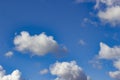 White clouds against blue sky background