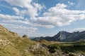 White clouds against blue sky over Sedlo Pass in Durmitor National Park Royalty Free Stock Photo