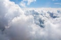 White clouds on blue sky background close up, cumulus clouds high in azure skies, beautiful aerial cloudscape view from above Royalty Free Stock Photo