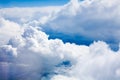 White clouds on blue sky background close up, cumulus clouds high in azure skies, beautiful aerial cloudscape view from above Royalty Free Stock Photo