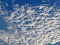 White clouds on blue sky background close up, cumulus clouds high in azure skies, beautiful aerial cloudscape view Royalty Free Stock Photo