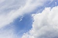 White clouds in blue sky background.