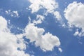 White clouds in blue sky background.