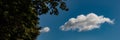 White clouds on a blue sky background on a sunny day. Web banner Royalty Free Stock Photo