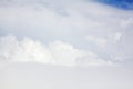 White clouds on blue sky background view from above, airplane flight landscape, beautiful aerial cloudscape, skies backdrop Royalty Free Stock Photo