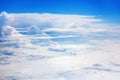 White clouds on blue sky background view from above, airplane flight landscape, beautiful aerial cloudscape, skies backdrop Royalty Free Stock Photo