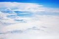 White clouds on blue sky background view from above, airplane flight landscape, beautiful aerial cloudscape, skies backdrop Royalty Free Stock Photo