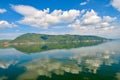 White clouds blue sky beautiful lake with wonderful mirror reflecion Royalty Free Stock Photo